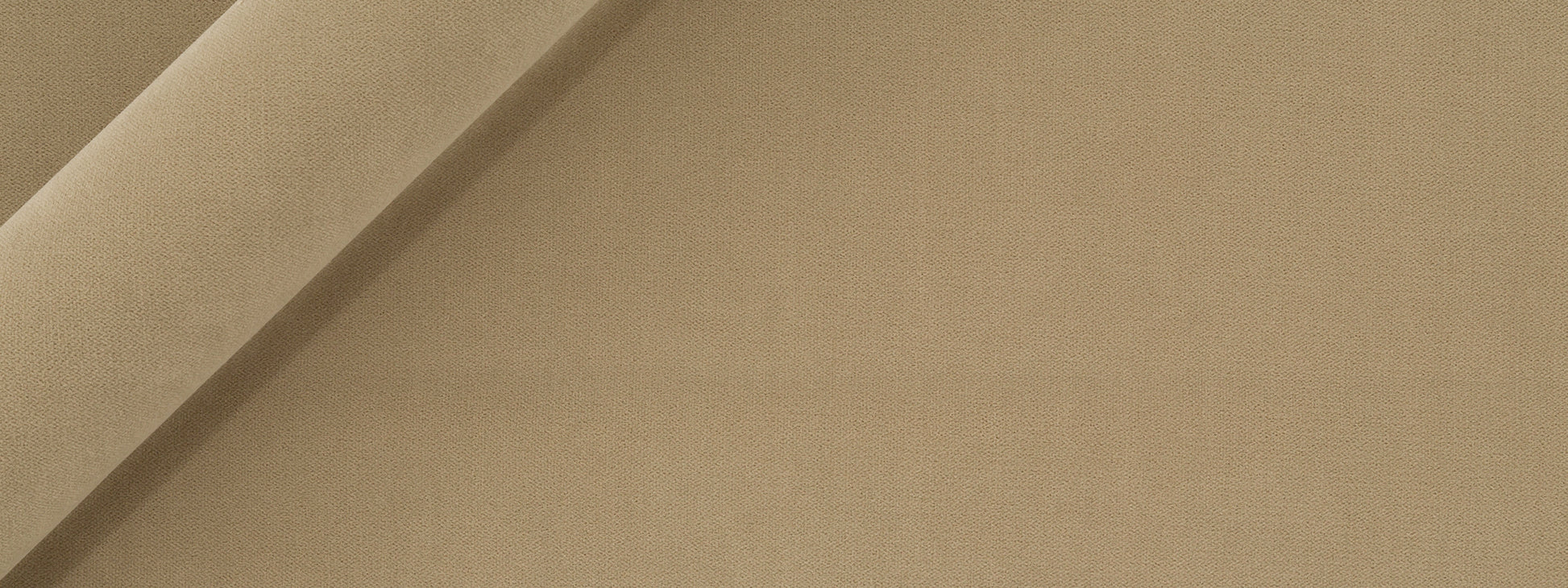 Beige velvet fabric with a diagonal fold and soft texture; versatile upholstery or drapery material.