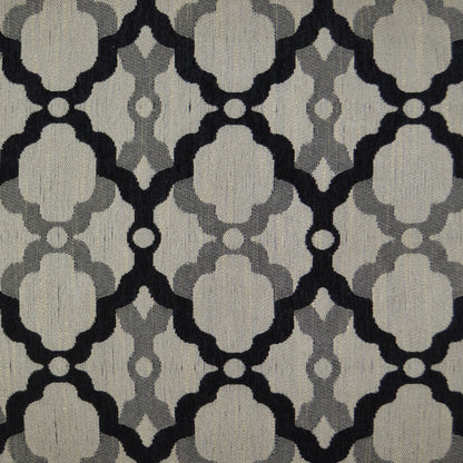 Beige woven pillow (24 x 24 in) with a repeating black and gray quatrefoil trellis pattern.