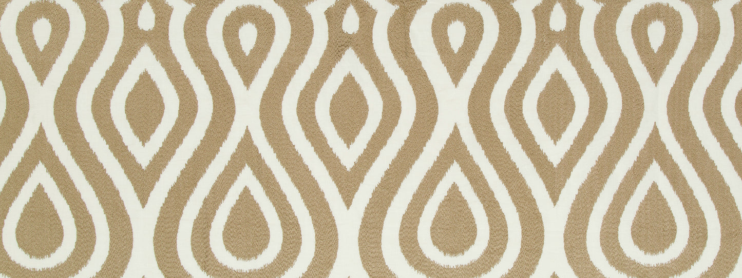 Beige fabric with a white teardrop-shaped repeating geometric motif; decorative textile.