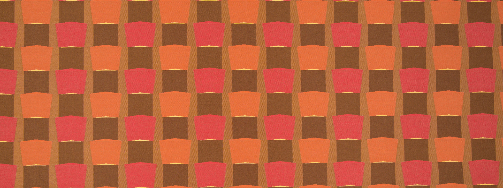 Orange, brown and pink checkerboard pattern with rounded-square blocks; retro textile design.