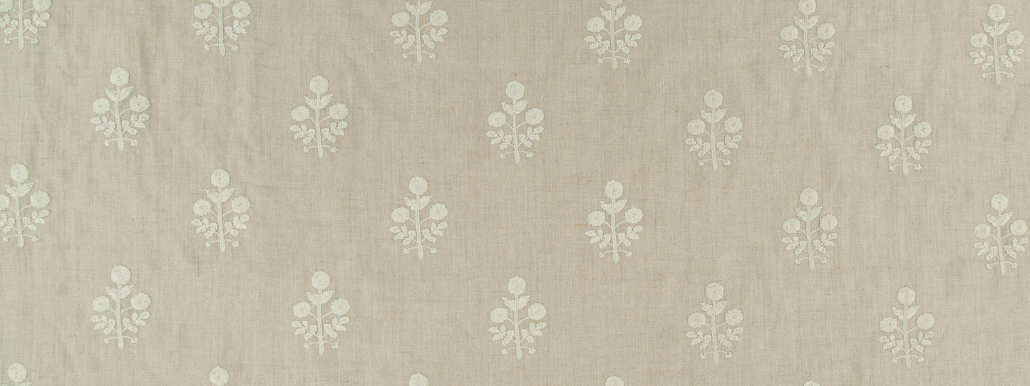 Beige linen-textured fabric with repeating white floral damask motifs; vintage upholstery or wallpaper use.