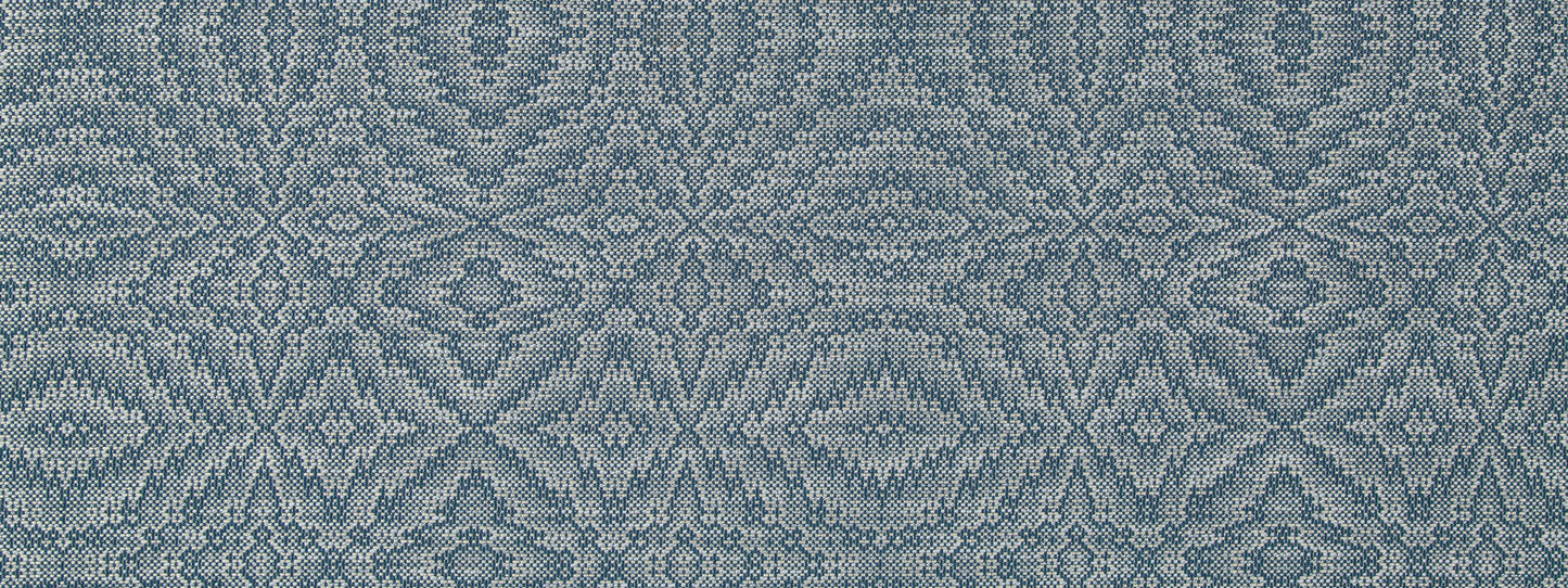 Blue-gray woven fabric with intricate geometric pattern, damask/ikat-inspired; ideal for upholstery or home decor.