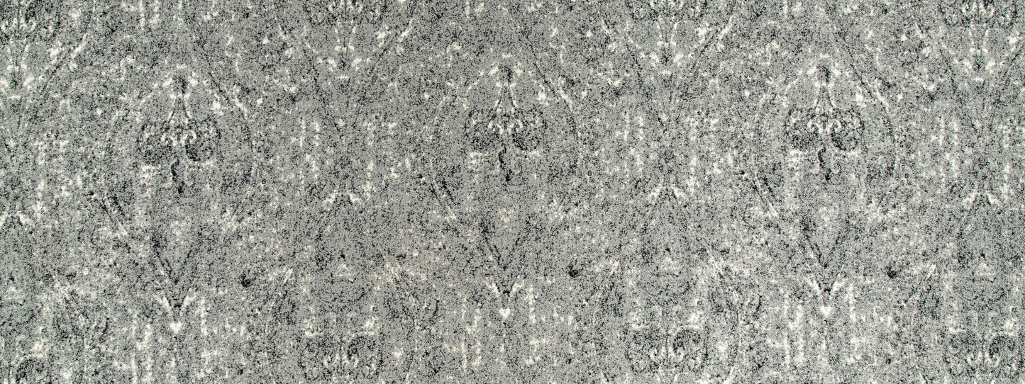 Grey damask-patterned upholstery fabric with a subtle speckled finish and ornate motifs.