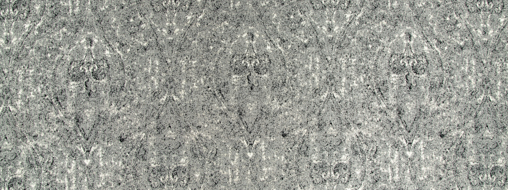 Grey damask-patterned upholstery fabric with a subtle speckled finish and ornate motifs.