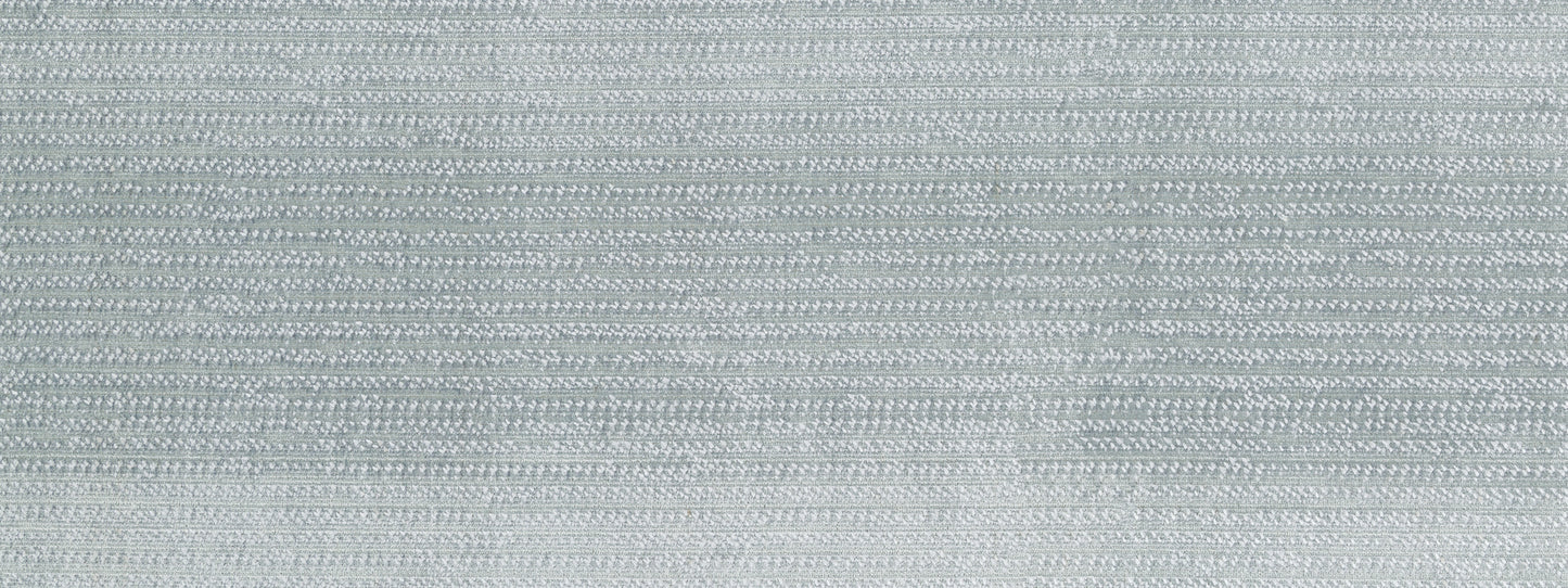 Light grey-blue velvet upholstery fabric with a subtle nap and soft texture.