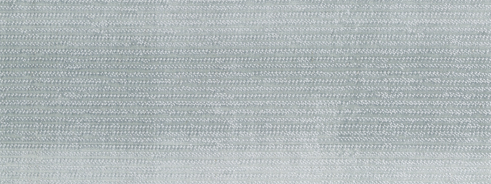 Light grey-blue velvet upholstery fabric with a subtle nap and soft texture.