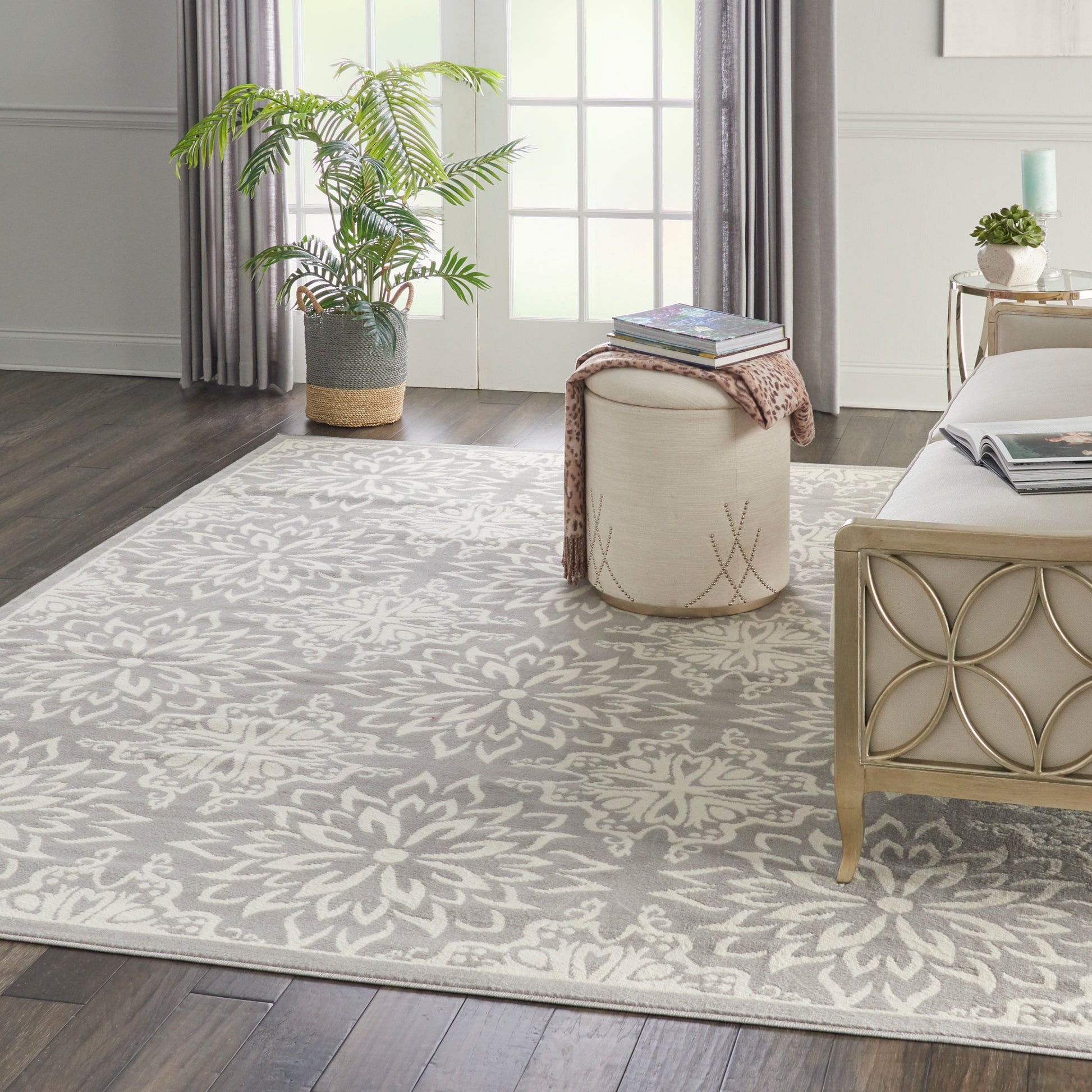 Ivory rectangular area rug with a soft gray floral pattern for living room decor.