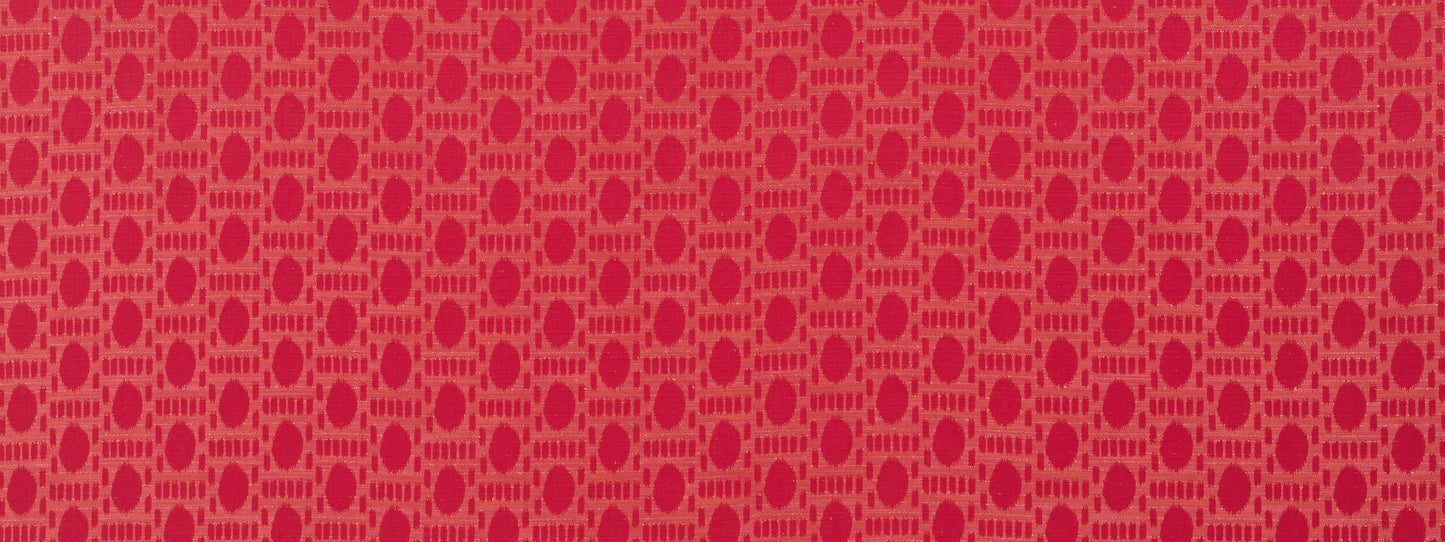 Red fabric with repeating pink circular ring pattern forming a geometric lattice; ideal for upholstery or fashion.