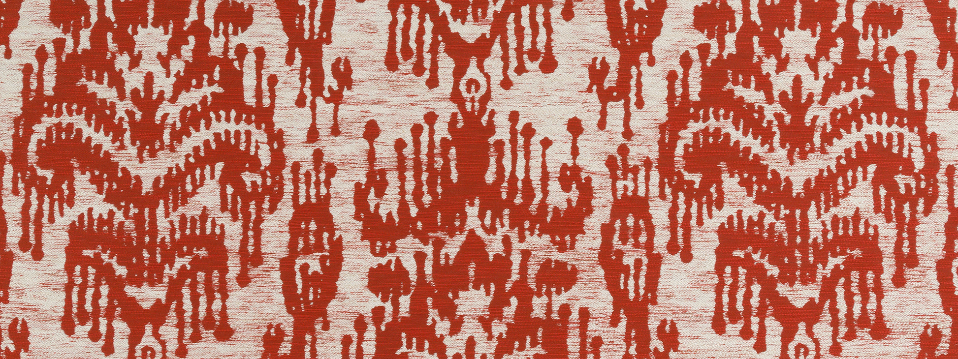 Painted Ikat pattern in Henna red on beige upholstery fabric; decorative textile for furniture or wall decor.