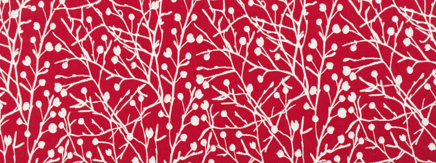 Red textile with white leafless-branch botanical pattern, repeating tree-like motif.