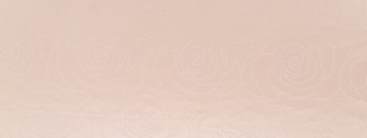 Blush camellia-weave drapery fabric with a subtle woven texture.