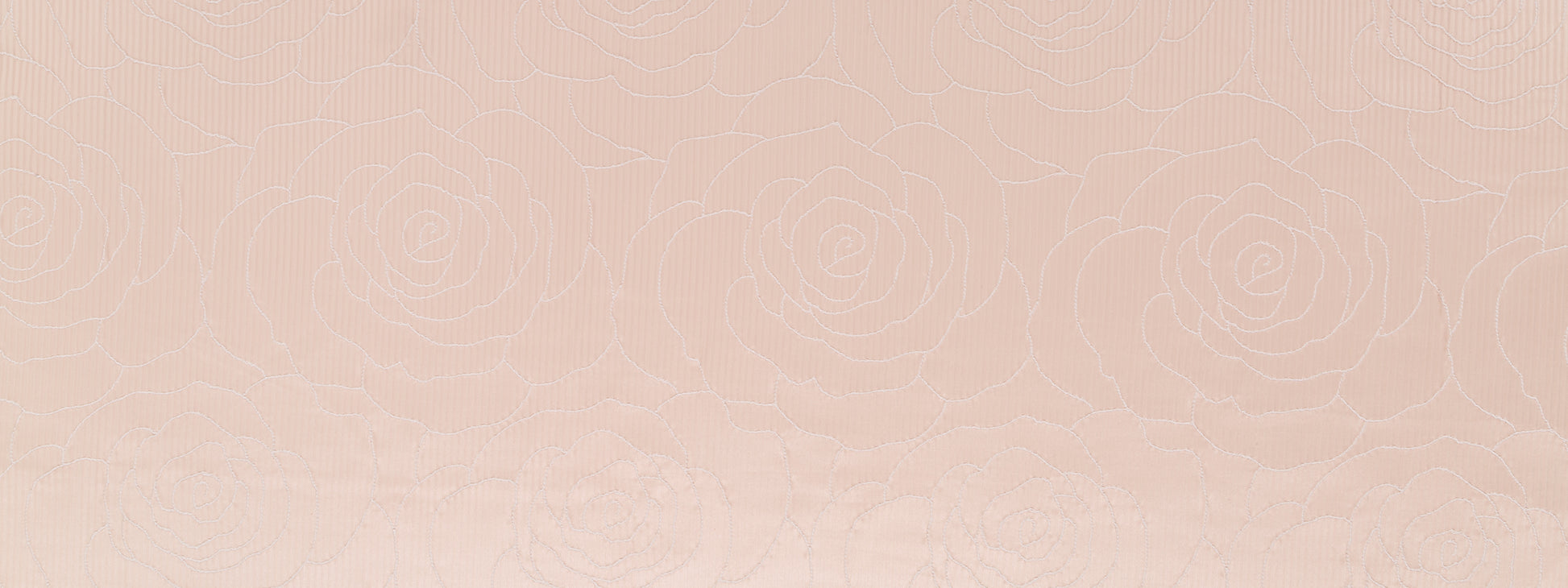 Blush camellia-weave drapery fabric with a subtle woven texture.