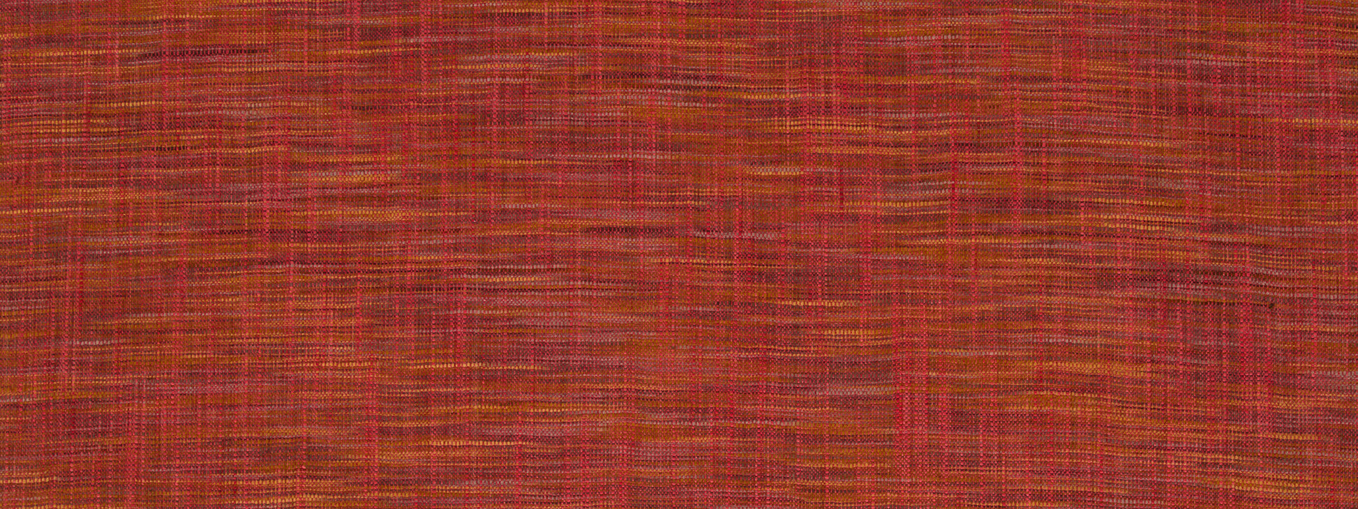 Close-up of red-orange woven drapery fabric texture with orange-yellow threads and a rustic, tactile pattern.