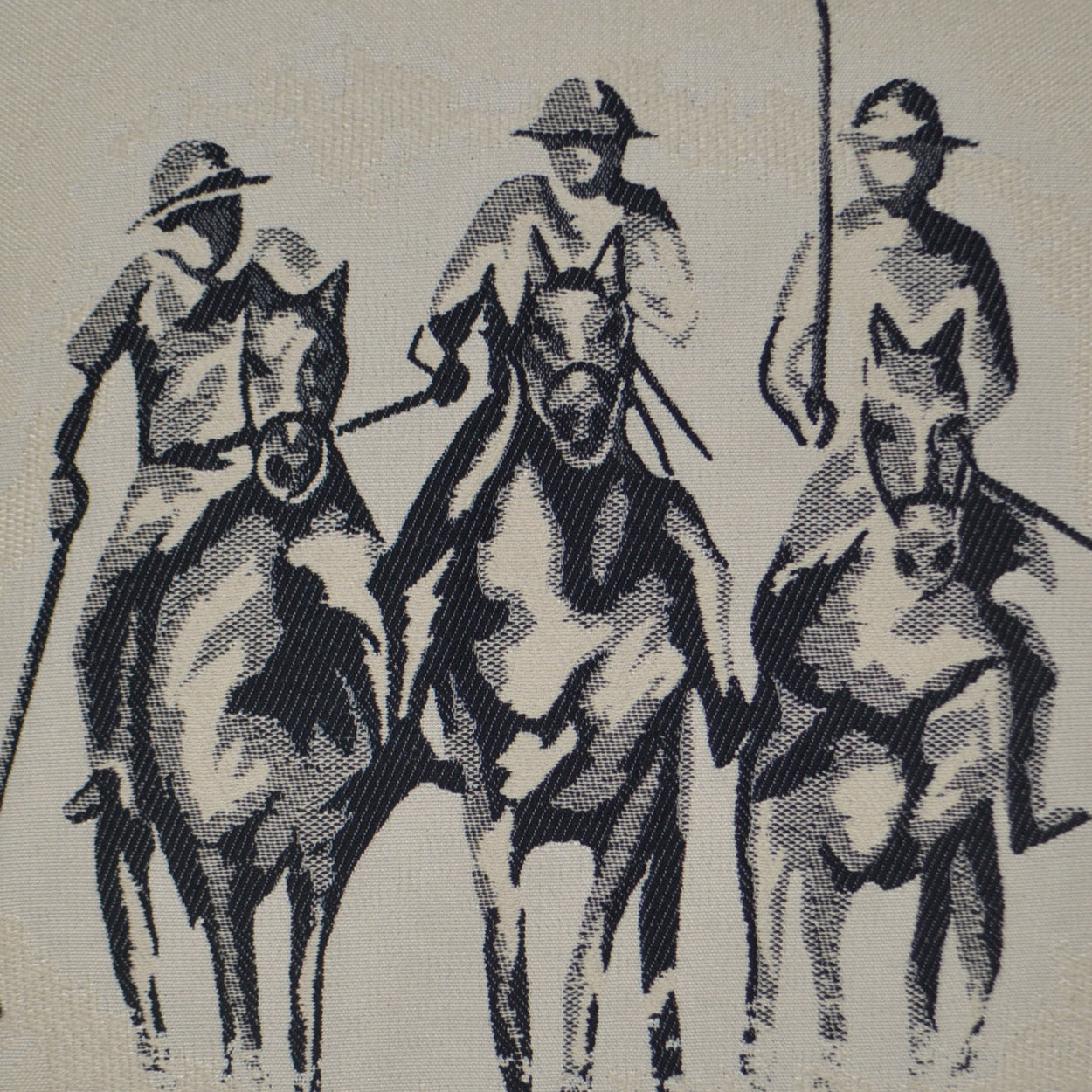 Monochrome fabric print of three cowboys on horses in vintage sketch style, Western equestrian motif for upholstery.