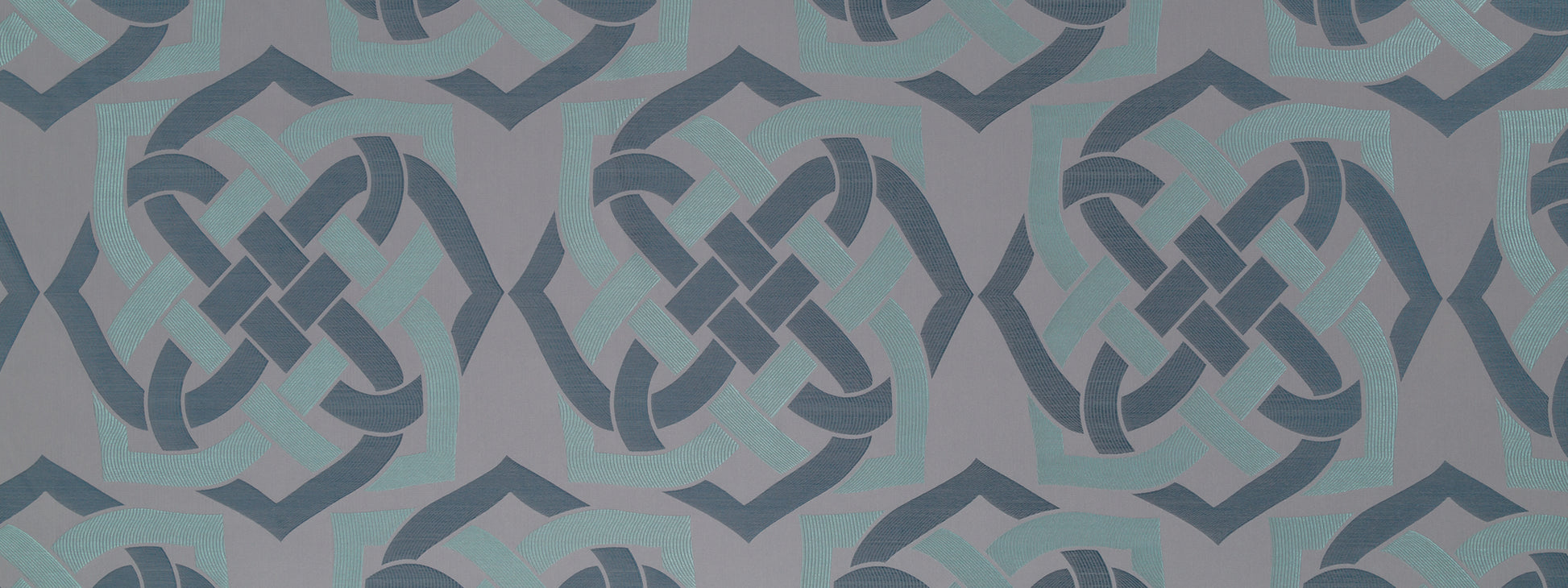 Blue-gray knotwork wallpaper with interlaced Celtic motifs; repeating geometric pattern.