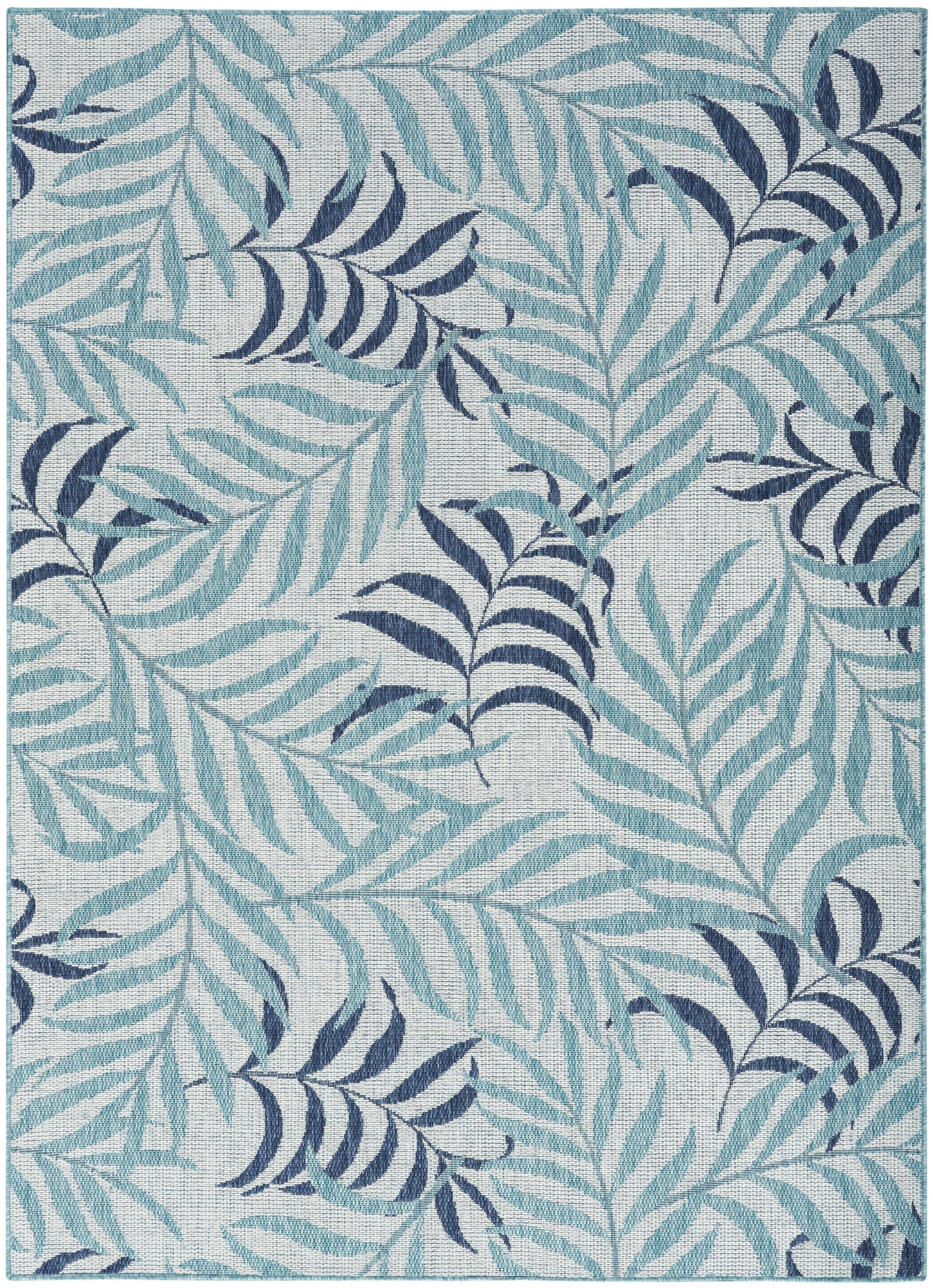 Teal & navy palm leaf patterned area rug on a light gray background.