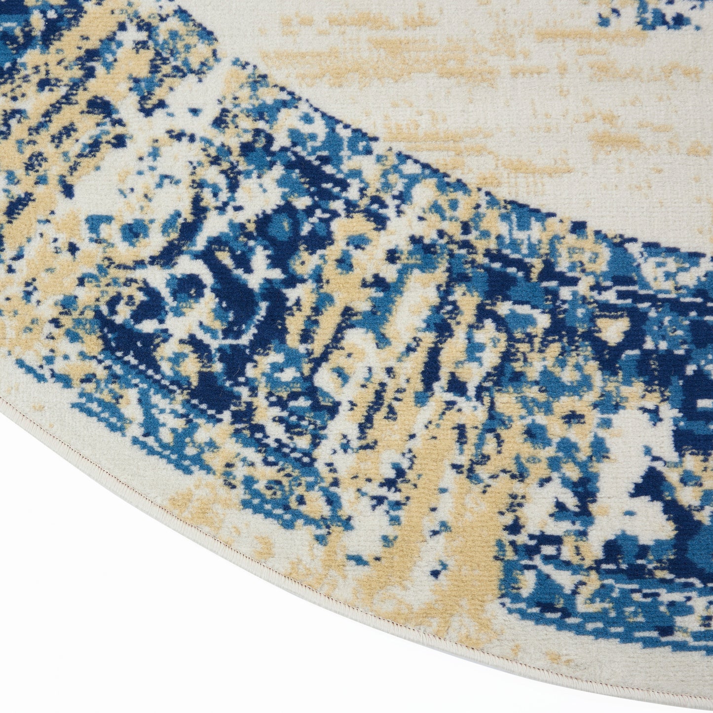Round area rug with abstract blue, beige and ivory pattern, woven texture and stitched edge.