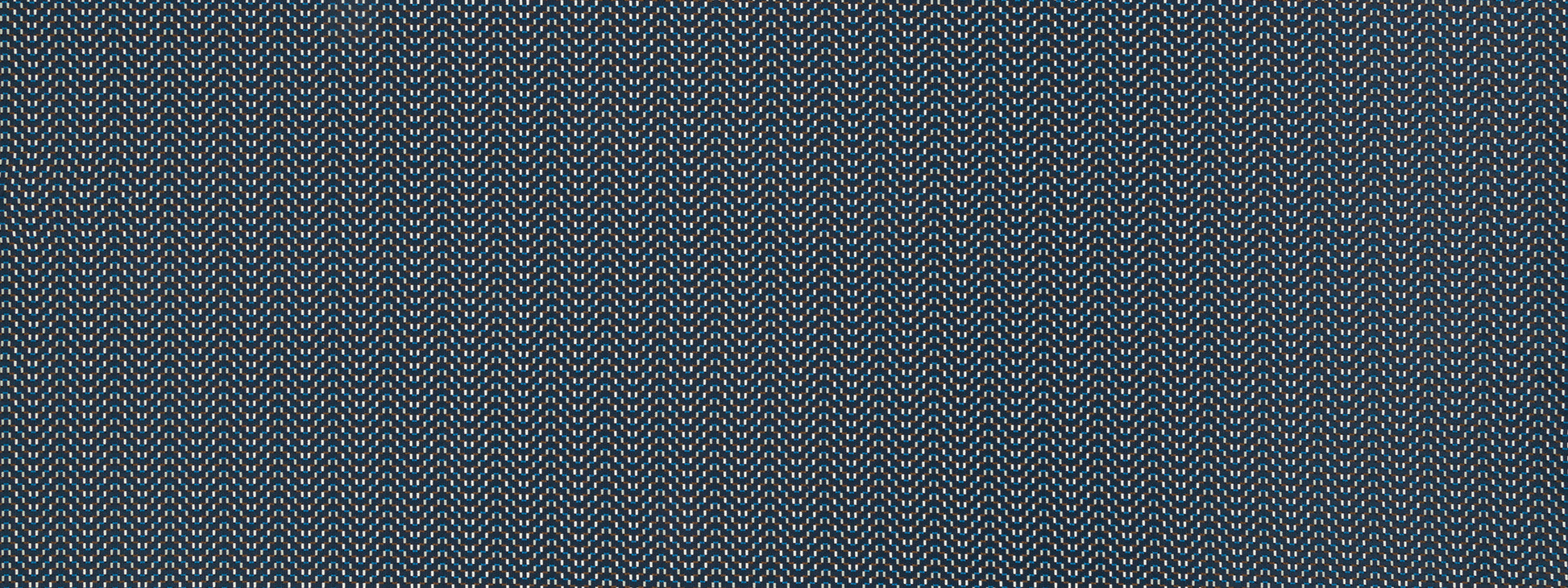 Close-up of blue woven fabric with subtle white flecks and textured diagonal weave.
