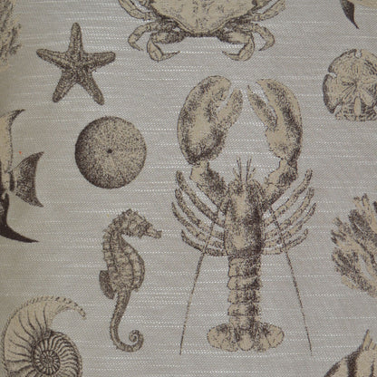 Beige fabric with brown nautical print featuring lobster, seahorse, starfish and seashells; coastal sea-life design.