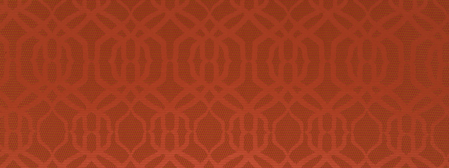 Close-up of burnt orange upholstery fabric with a repeating interlocking circular motif; textured textile.