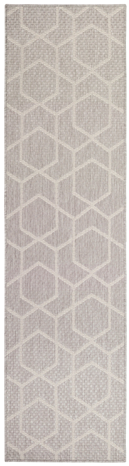 Textured flatweave runner rug with ivory geometric hexagon pattern on dusty taupe-lavender background.