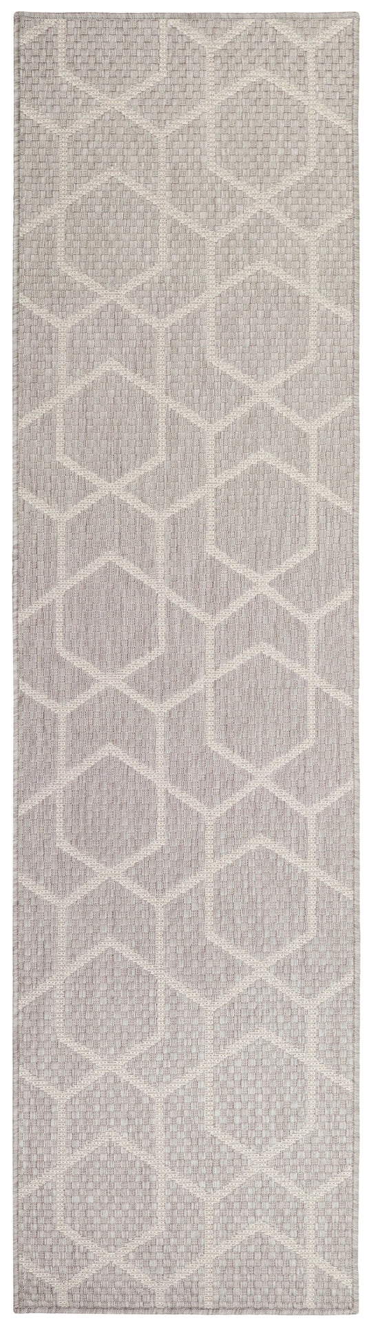 Textured flatweave runner rug with ivory geometric hexagon pattern on dusty taupe-lavender background.