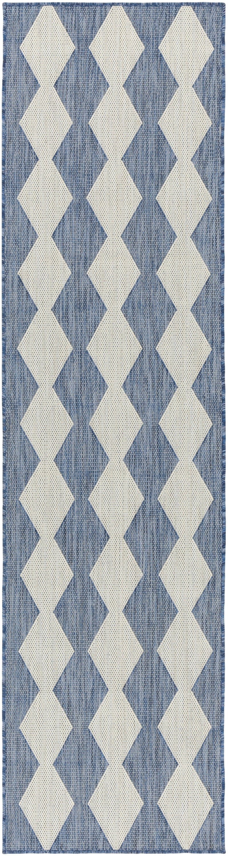 Blue woven rug runner with a repeating white diamond pattern along its length.