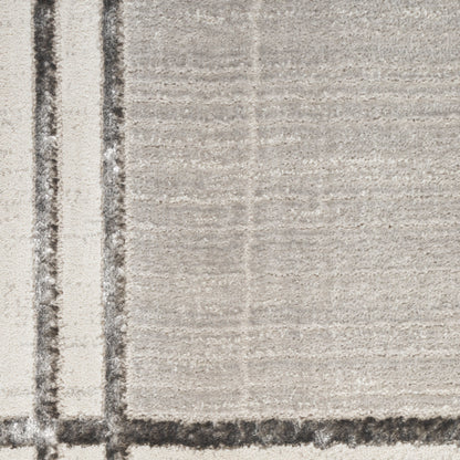 Beige textured area rug with dark charcoal plaid lines forming a soft, neutral grid.