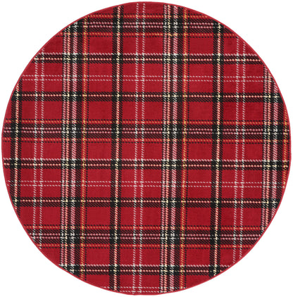 Round red tartan plaid fabric placemat with black and white lines for table setting.