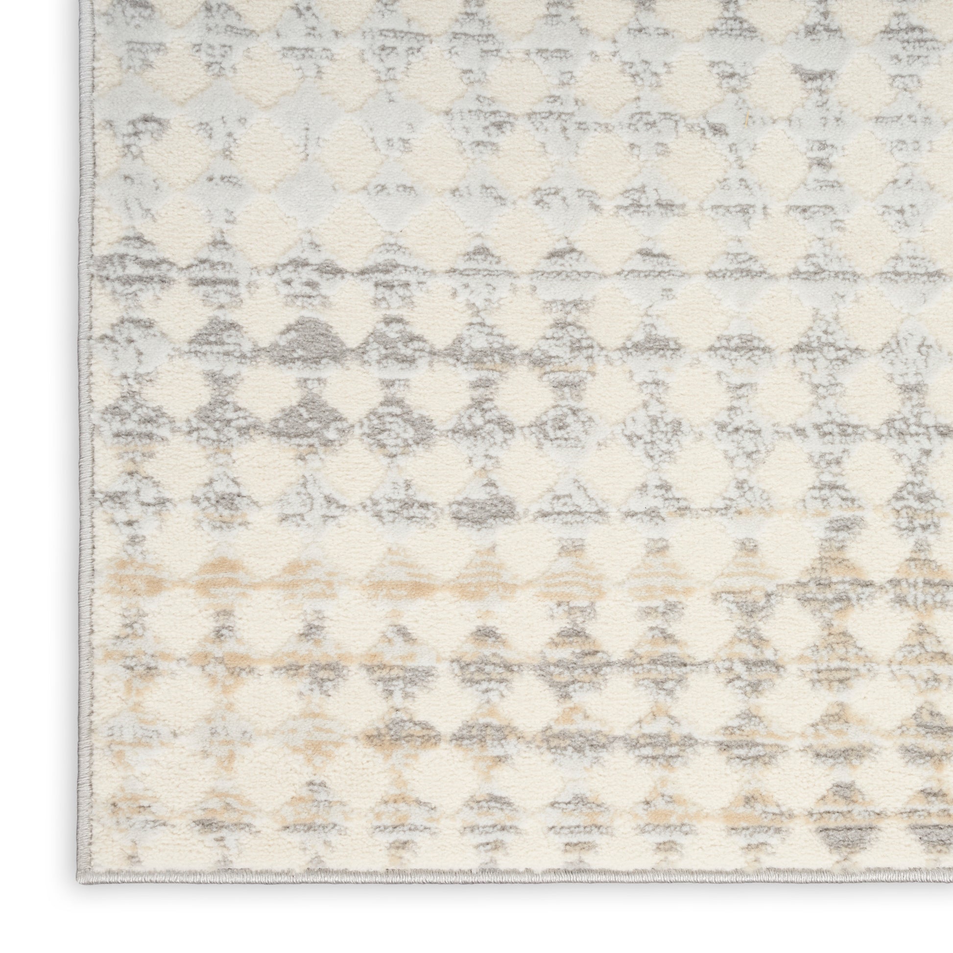 Rectangular cream gray geometric rug with beige accents, plush tufted pile for a modern living room.