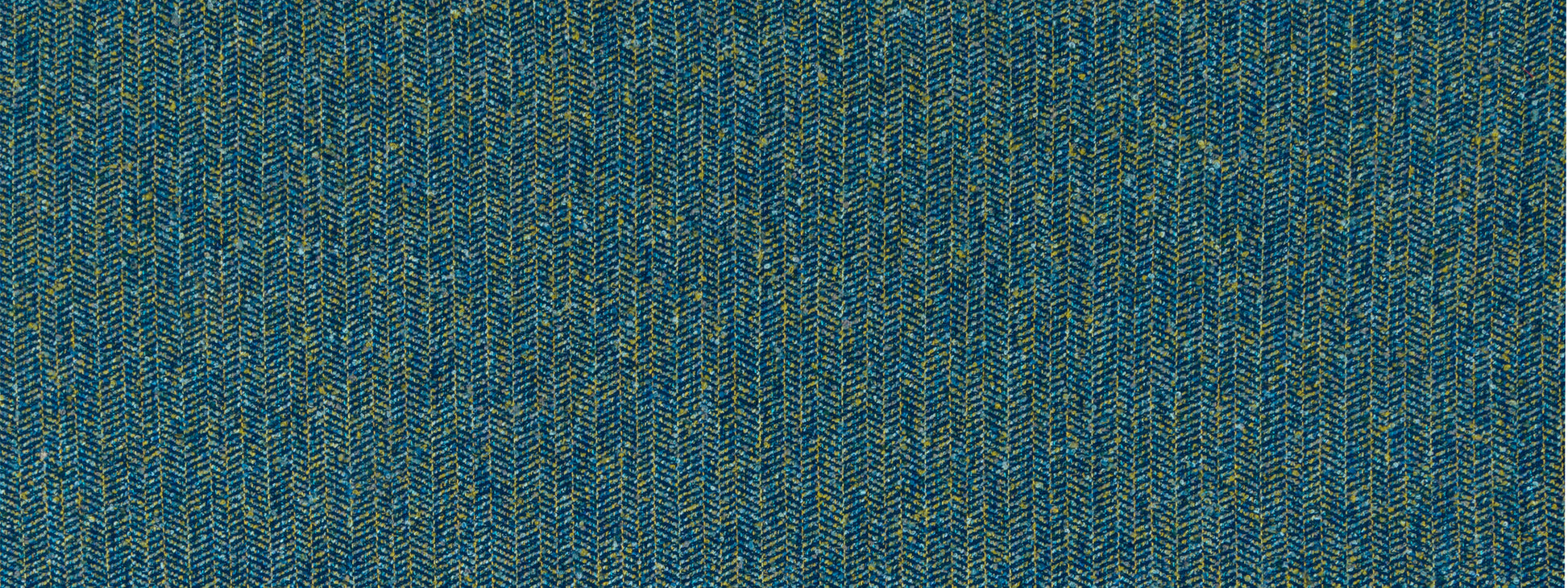 Blue herringbone tweed upholstery fabric with subtle yellow flecks.