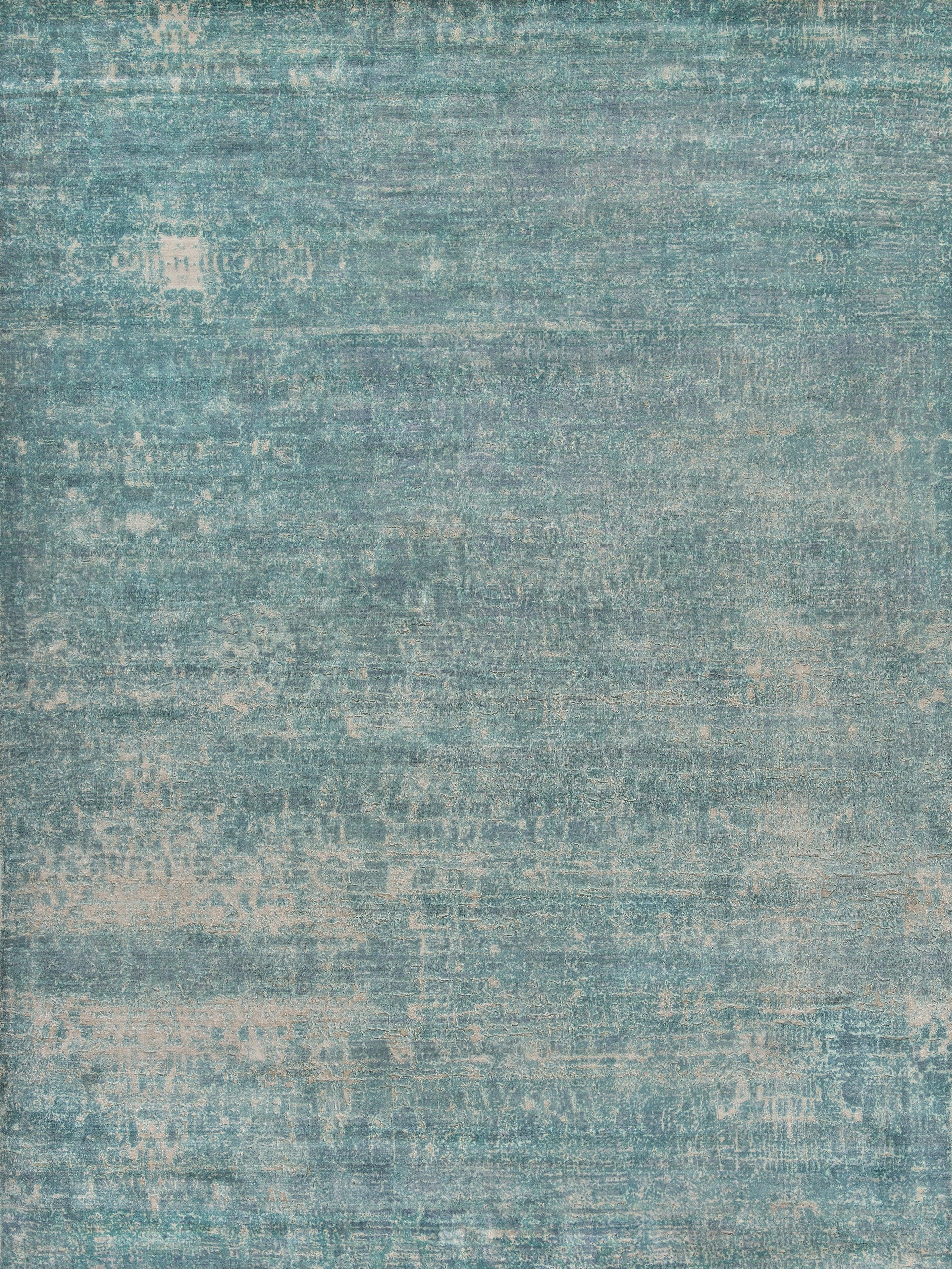 Teal distressed indoor hand loomed rug with vintage washed texture in blue-green tones; 6' x 9'.