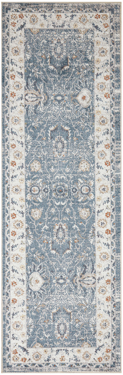 Blue runner rug with ivory border and orange accents; ornate Persian-inspired floral medallions for hallway decor.