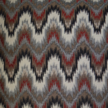 24" x 24" pillow with woven fabric featuring a bold chevron zigzag in brown, gray, black and maroon; rustic ikat-inspired textile.