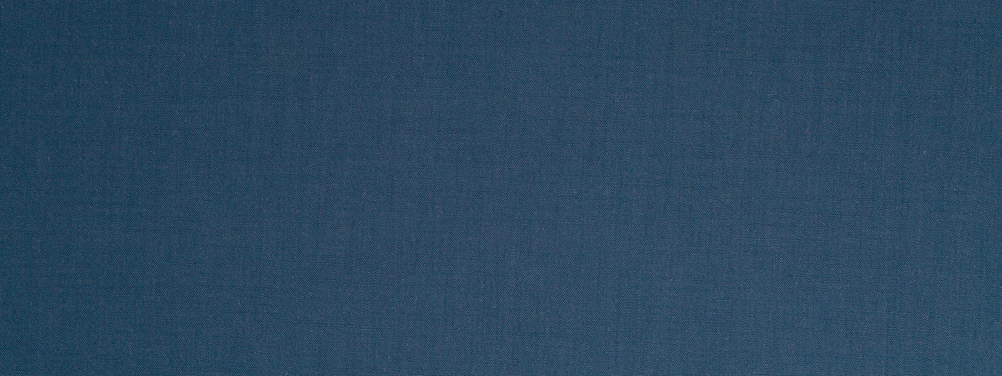 Dark indigo woven upholstery fabric texture with subtle grain.