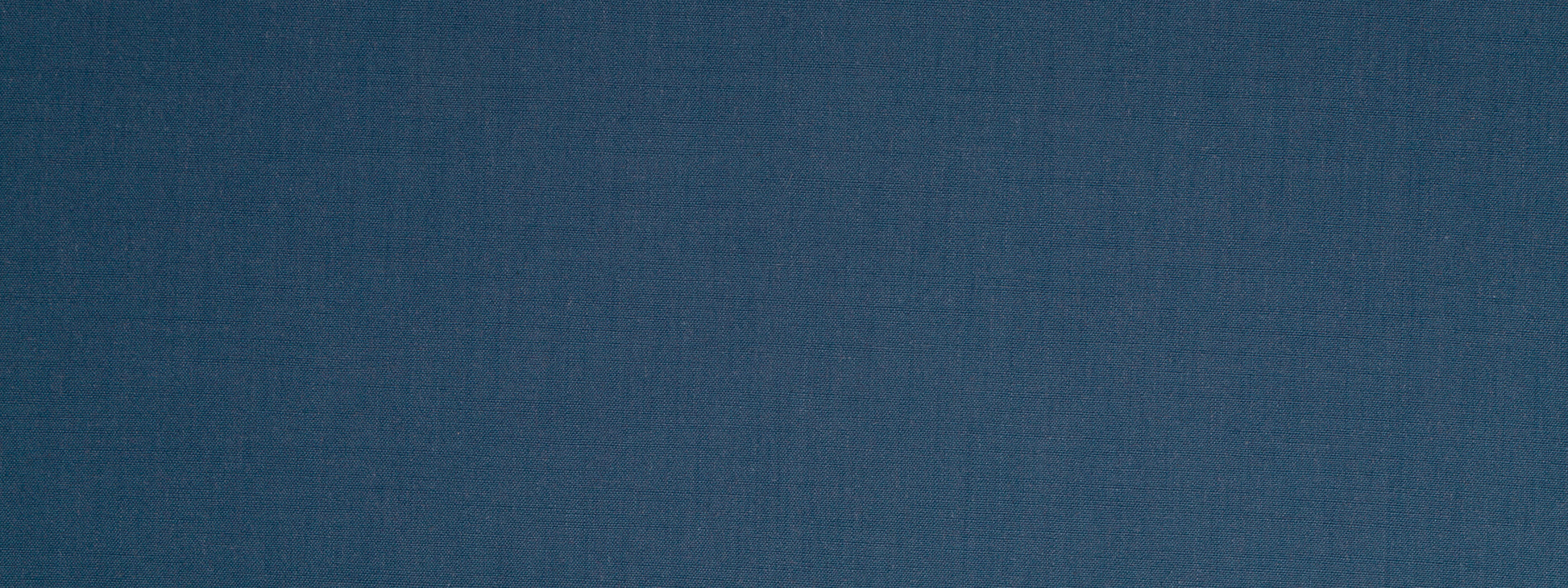 Dark indigo woven upholstery fabric texture with subtle grain.