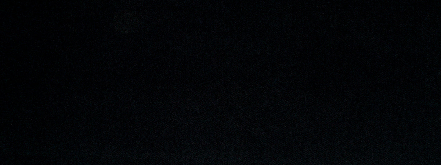 Solid black upholstery fabric with faint texture and subtle shading; minimal, versatile material.