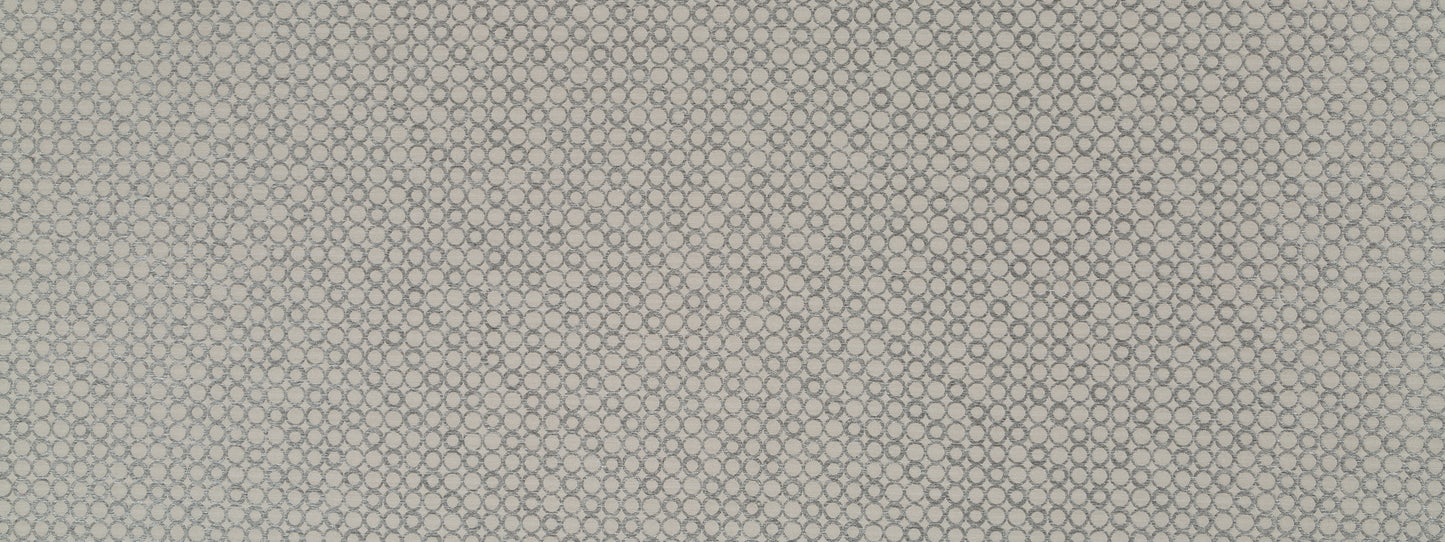 Beige textured upholstery fabric swatch with a tiny circular pattern and subtle woven texture.