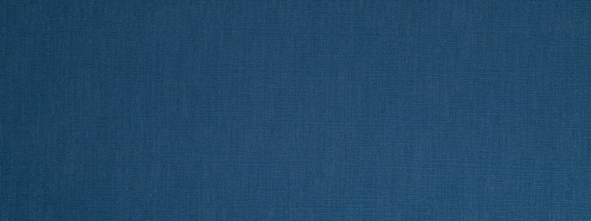 Close-up of deep blue upholstery fabric texture with a fine weave.