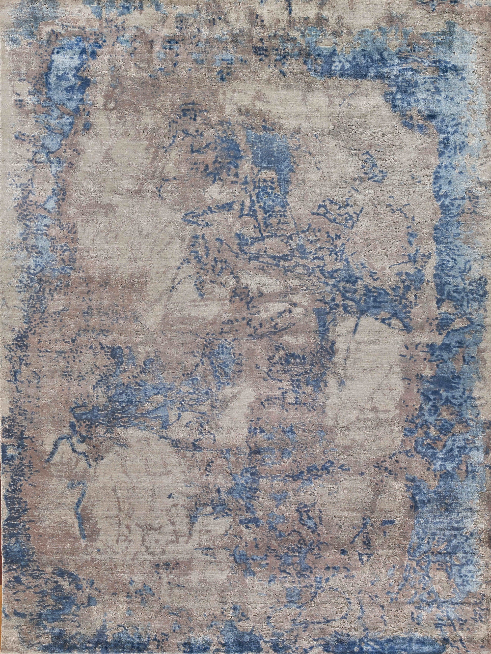 Beige and blue abstract area rug with a distressed painterly pattern; soft woven texture for living rooms.
