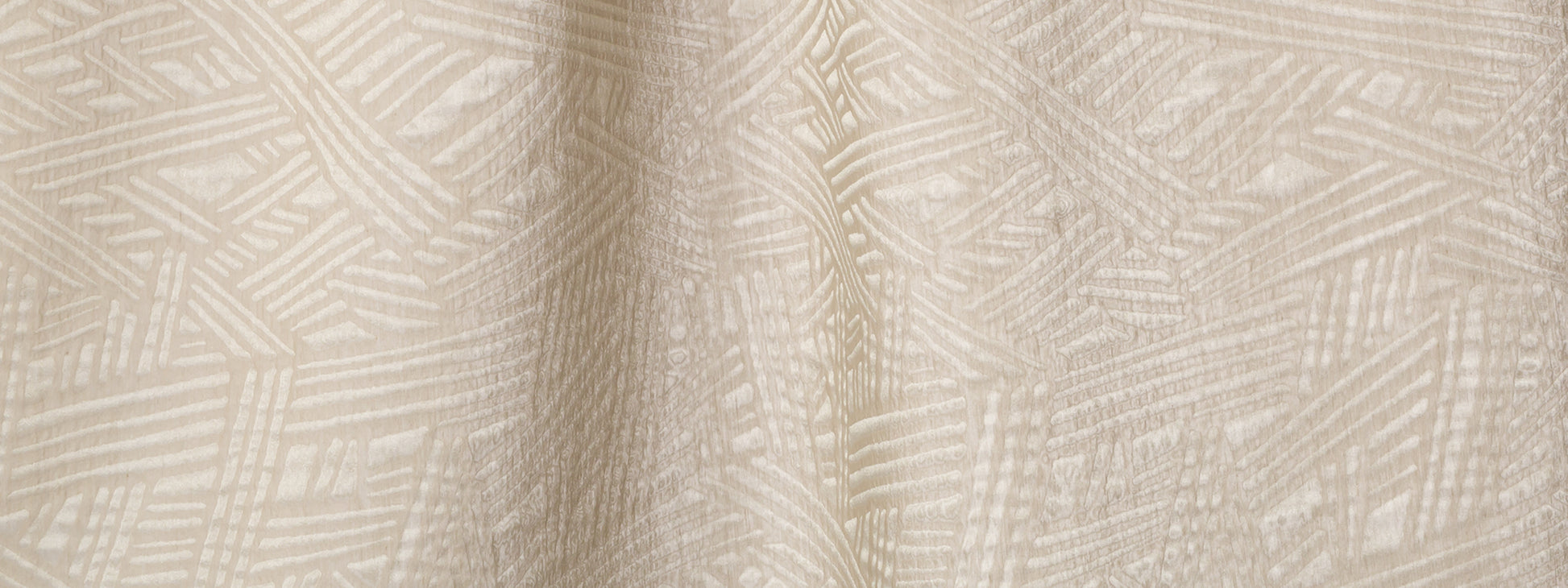 Beige woven fabric with geometric linear pattern; textured jacquard textile in cream tones for upholstery or curtains.