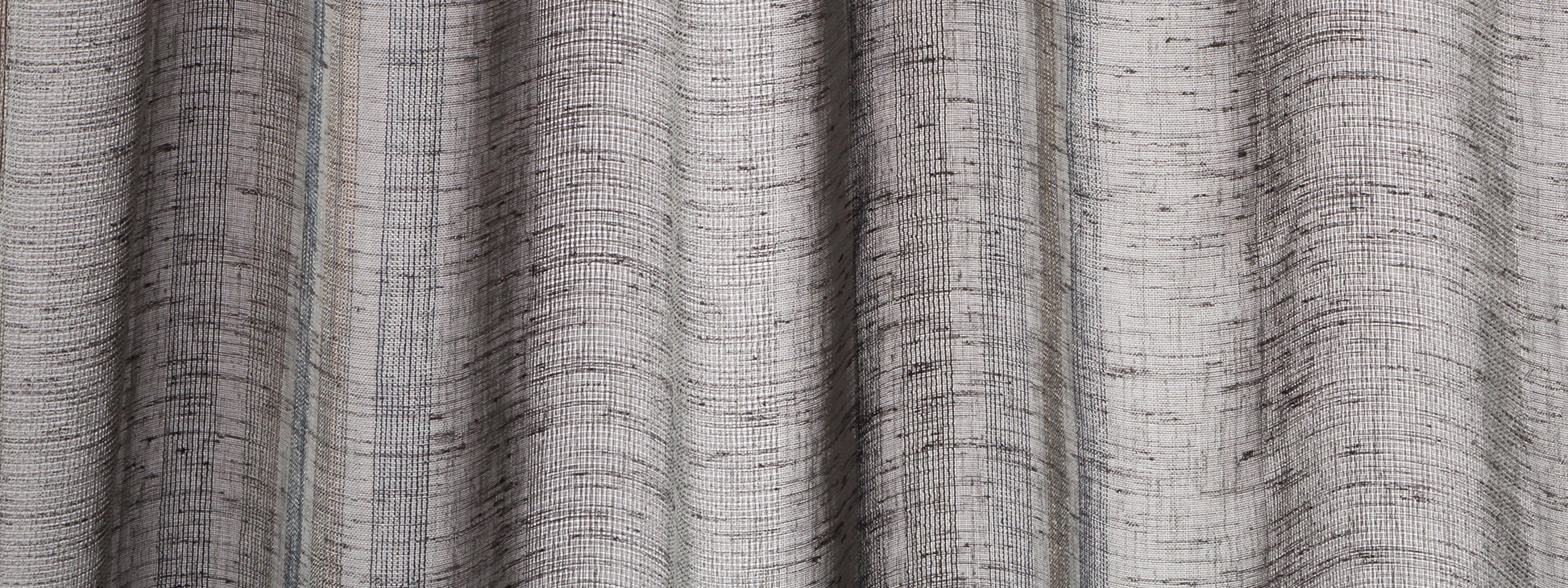Indigo linen-look curtain panels with textured weave and soft vertical folds.