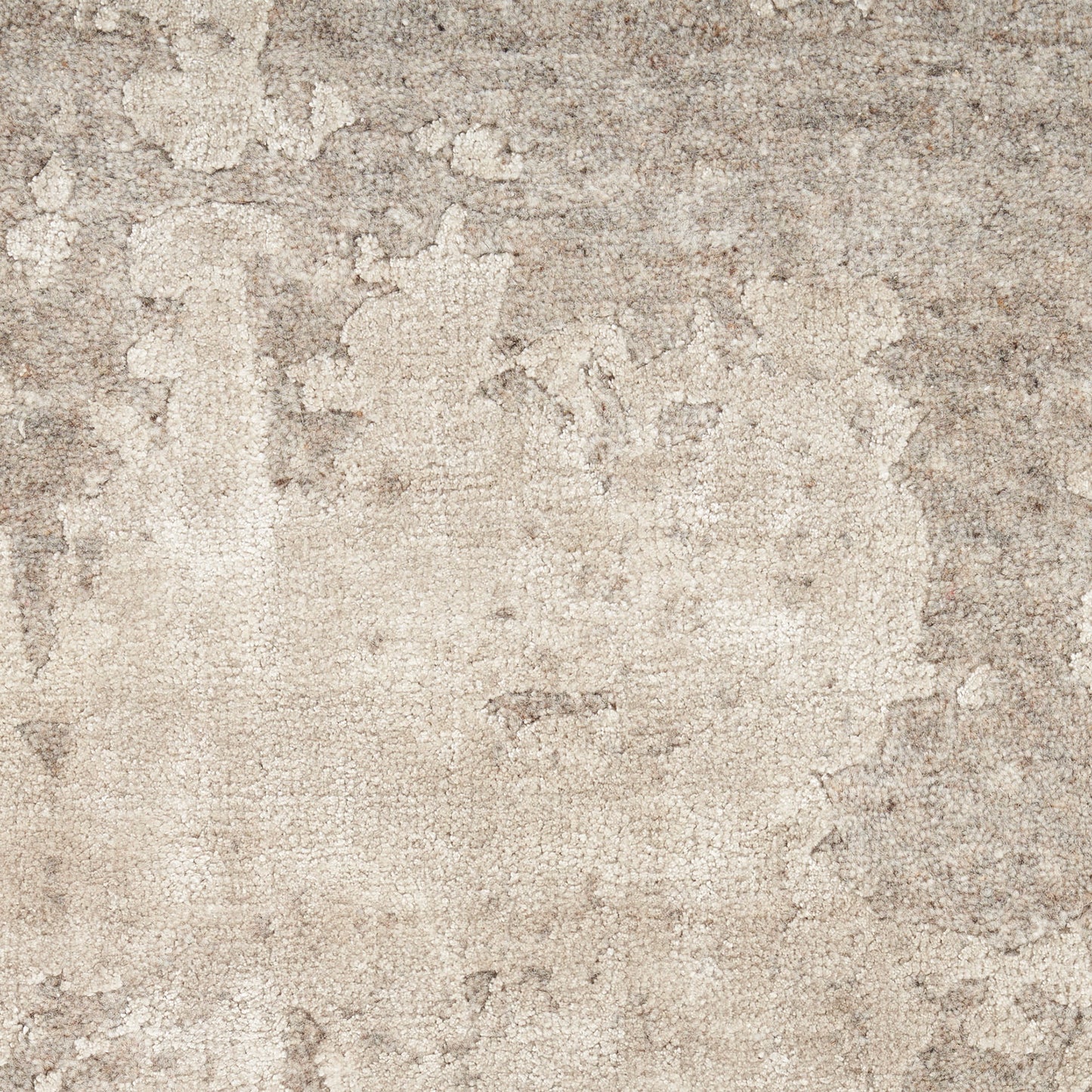 Beige distressed plaster/stone wall texture with weathered patches.