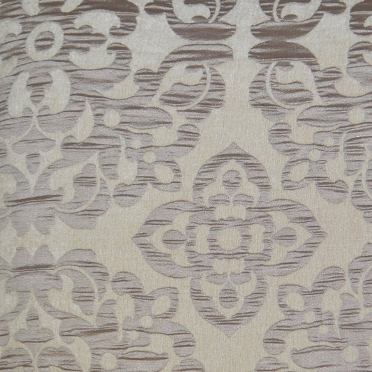 Beige woven fabric with muted gray-lavender damask pattern and ornate floral motif; upholstery or drapery textile.