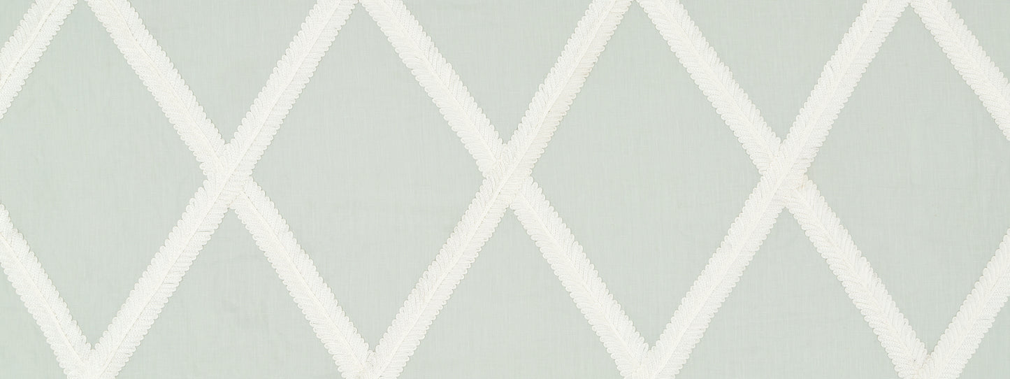 Soft sage green wallpaper with a white diamond lattice geometric pattern.