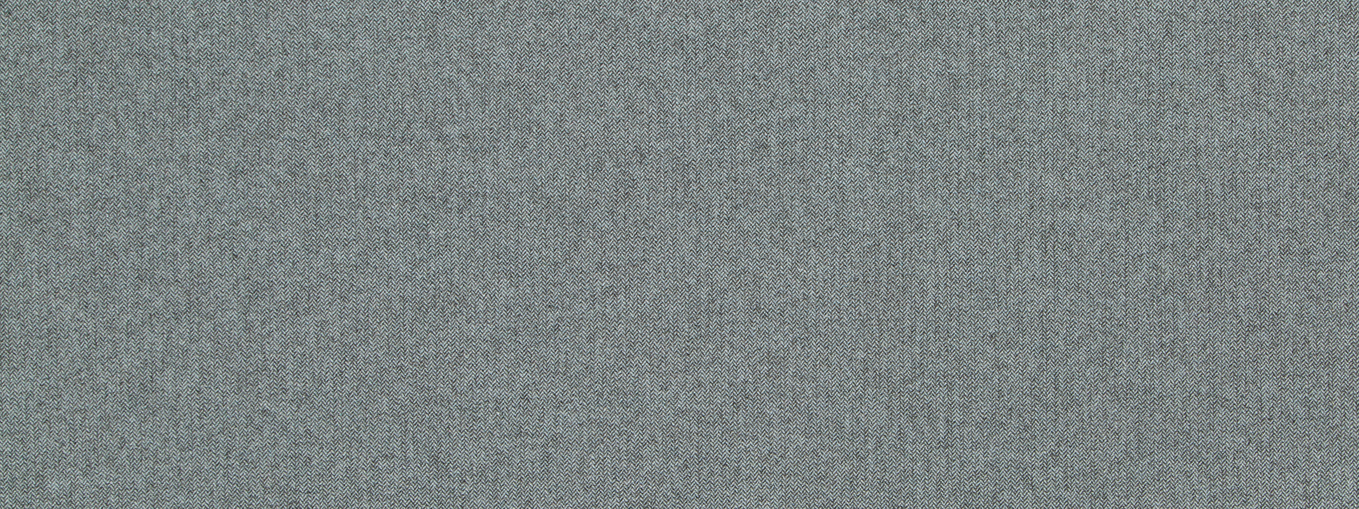Close-up of light gray wool chevron upholstery fabric texture.