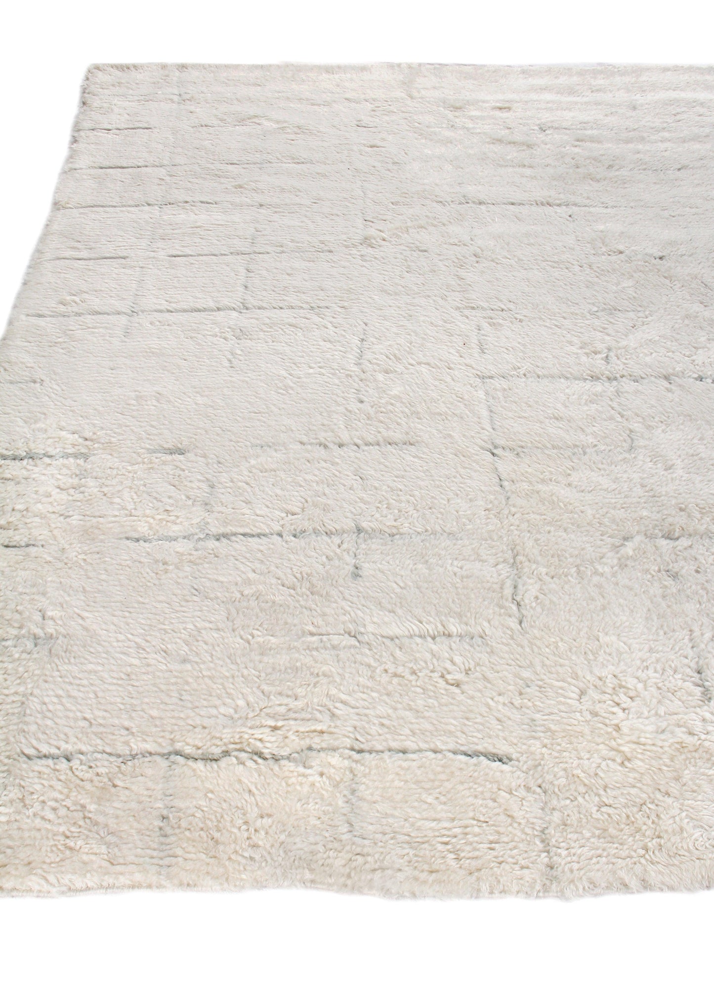 Cream Moroccan indoor hand-knotted rug, 6' x 9', with a subtle geometric pattern and textured pile.