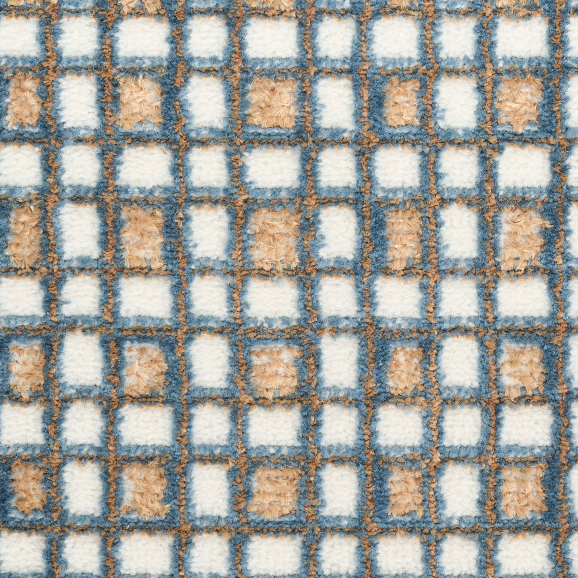Blue-gray grid rug with white and tan square blocks; plush loop-pile texture and geometric checker pattern.