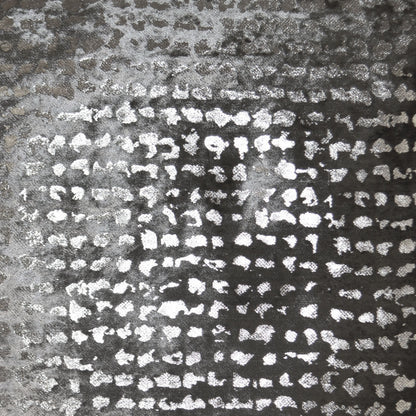 Dark charcoal pillow with irregular white speckles; textured, tweed-like surface.