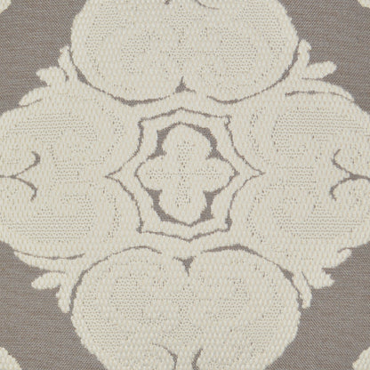 Cream embroidered damask floral medallion on flax fabric pillow.